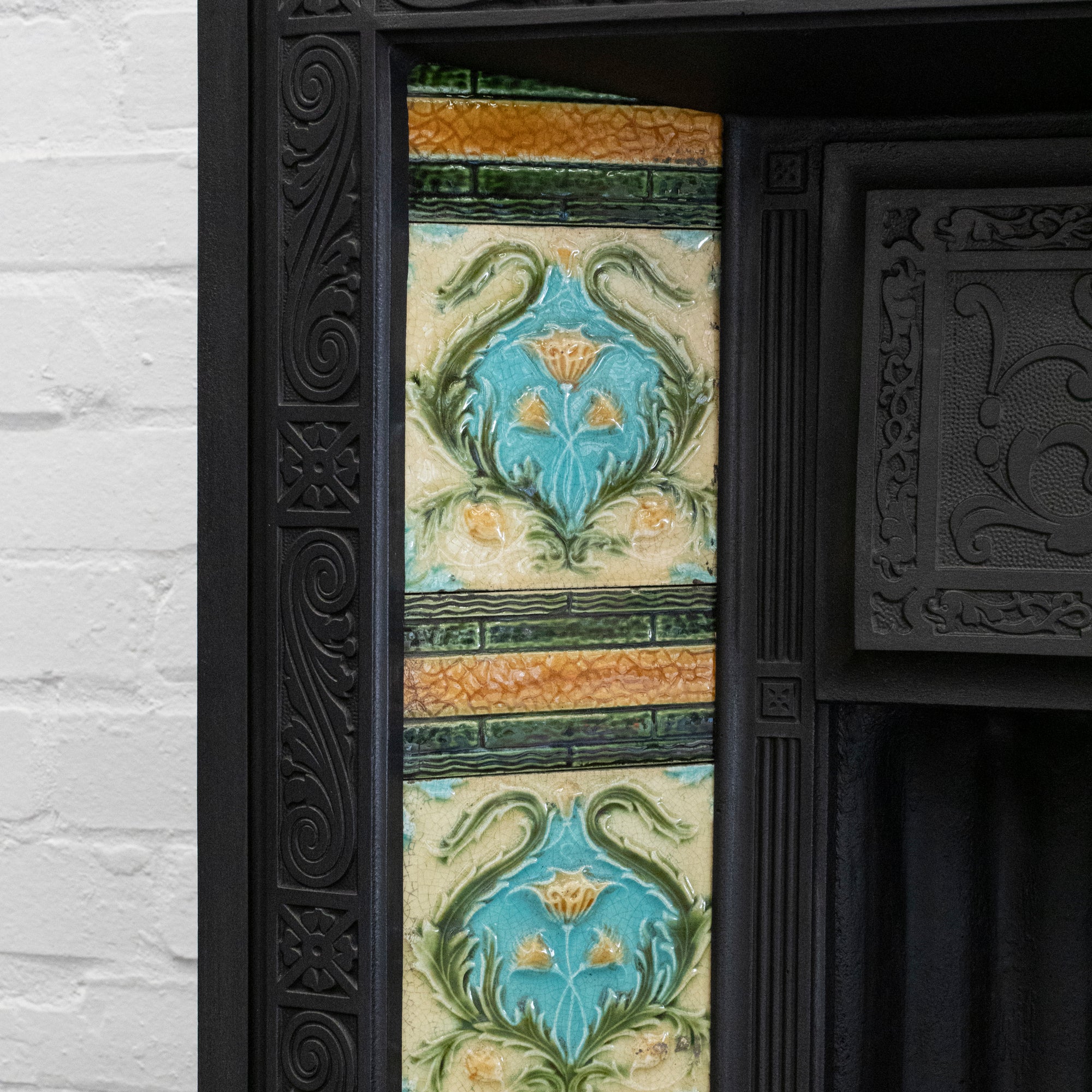 Antique Cast iron Fireplace Insert with Green & Blue Tiles | The Architectural Forum