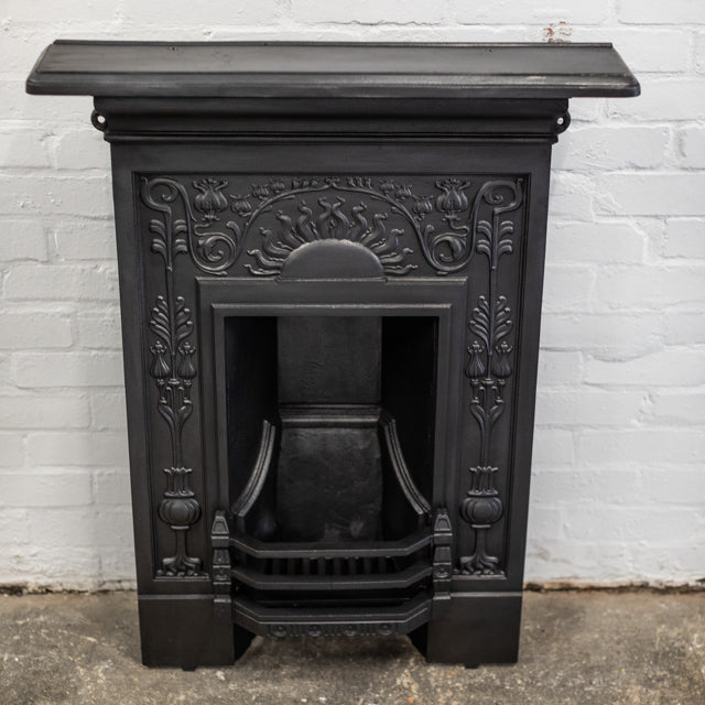 Antique Iron Combination Fireplace With Ornate Details | The Architectural Forum