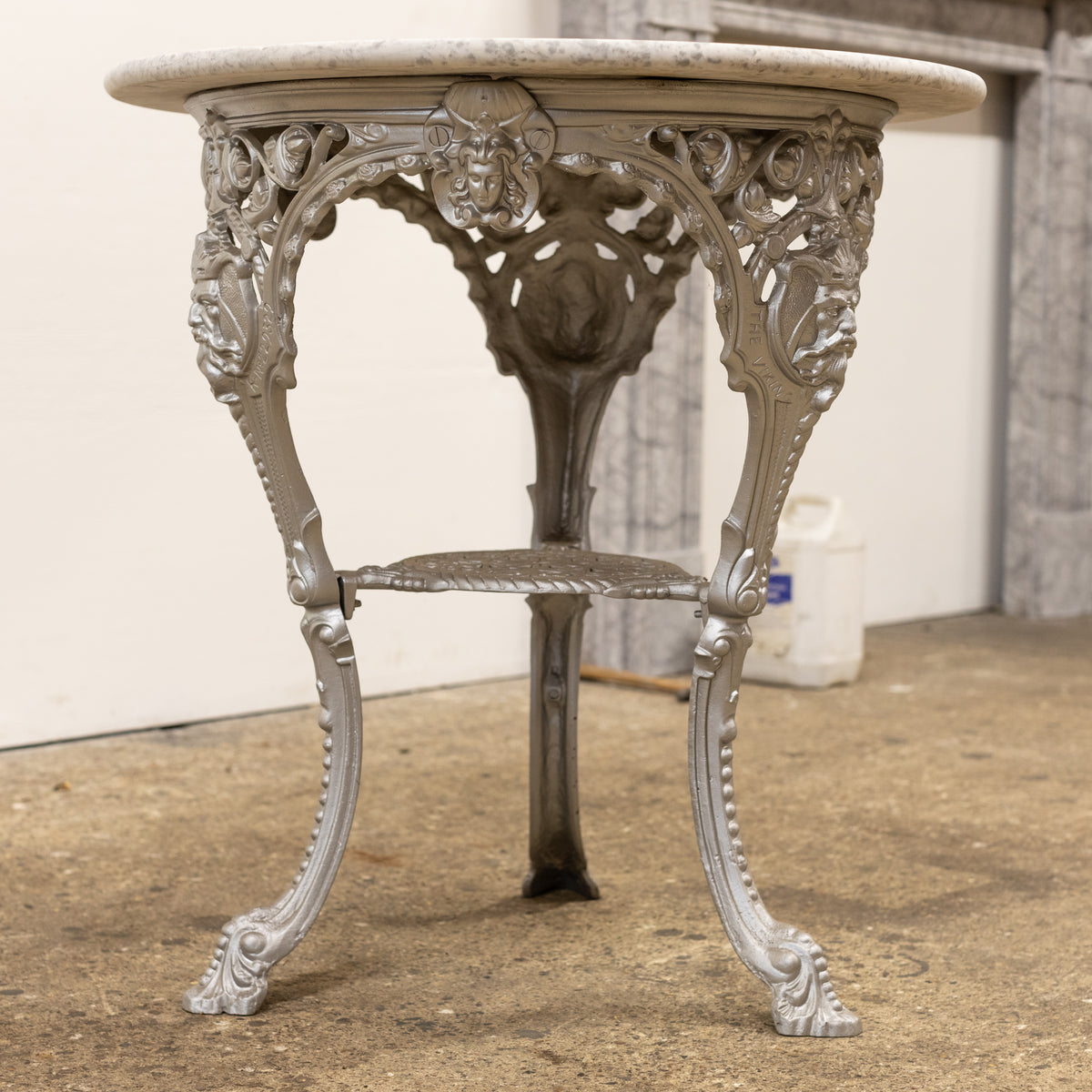 Antique Cast Iron Round Table with Marble Top | The Viking | The Architectural Forum