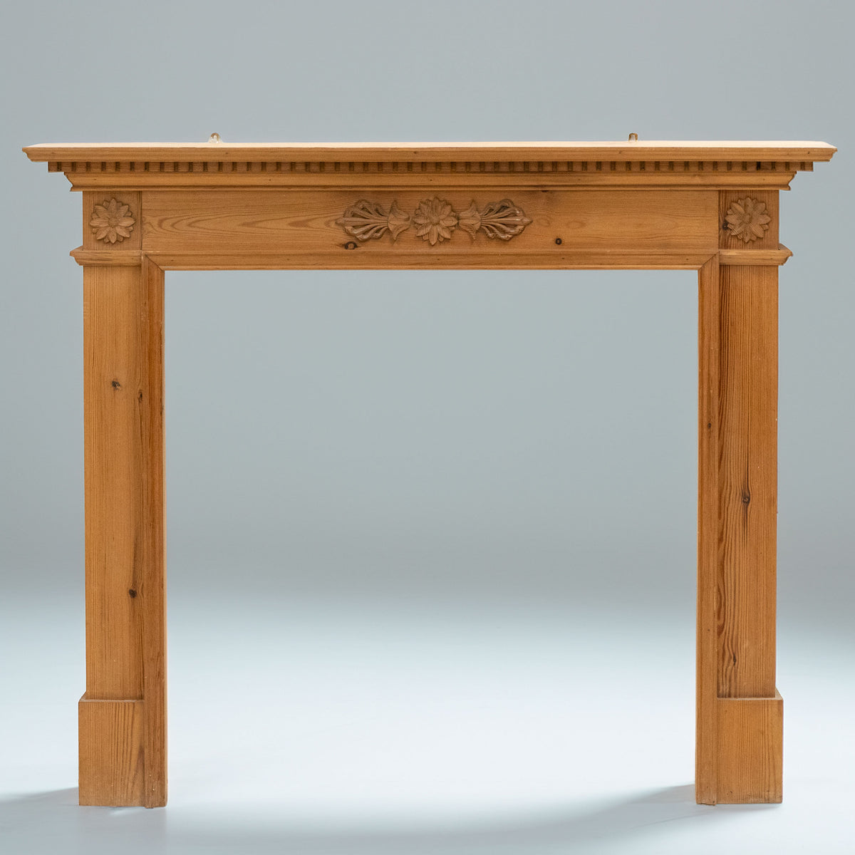 Antique Wooden Fireplace Surround with Flowers