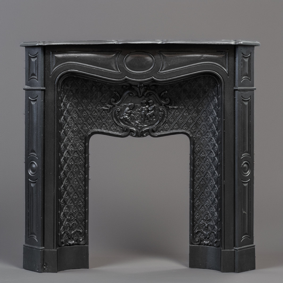Rare Highly Ornate Antique Cast Iron Fireplace Surround | Pair Available