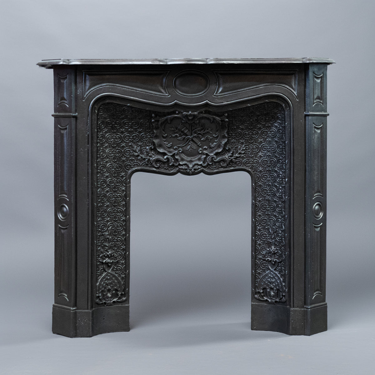 Rare Highly Ornate Antique Cast Iron Fireplace Surround | Pair Available