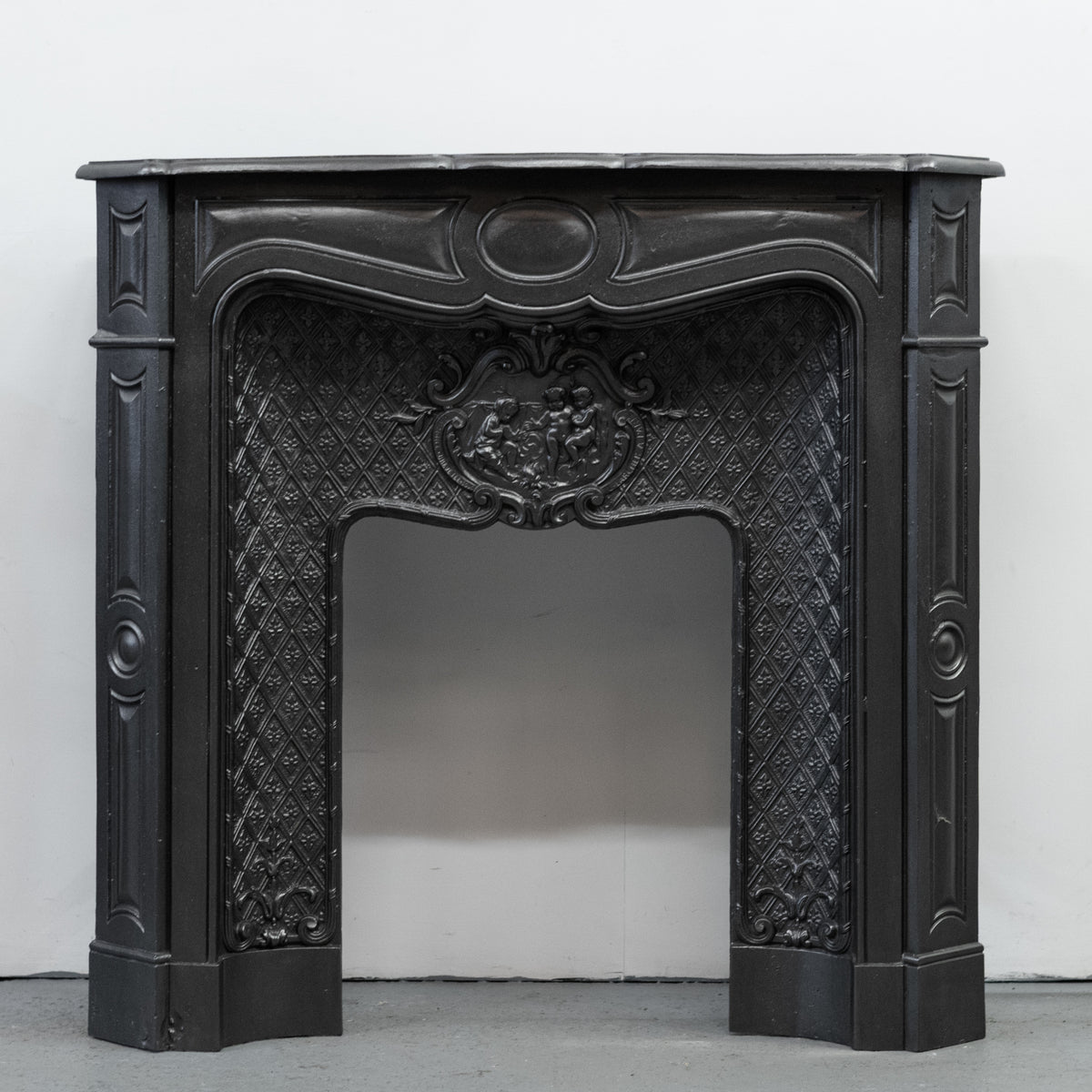 Rare Highly Ornate Antique Cast Iron Fireplace Surround | Pair Available