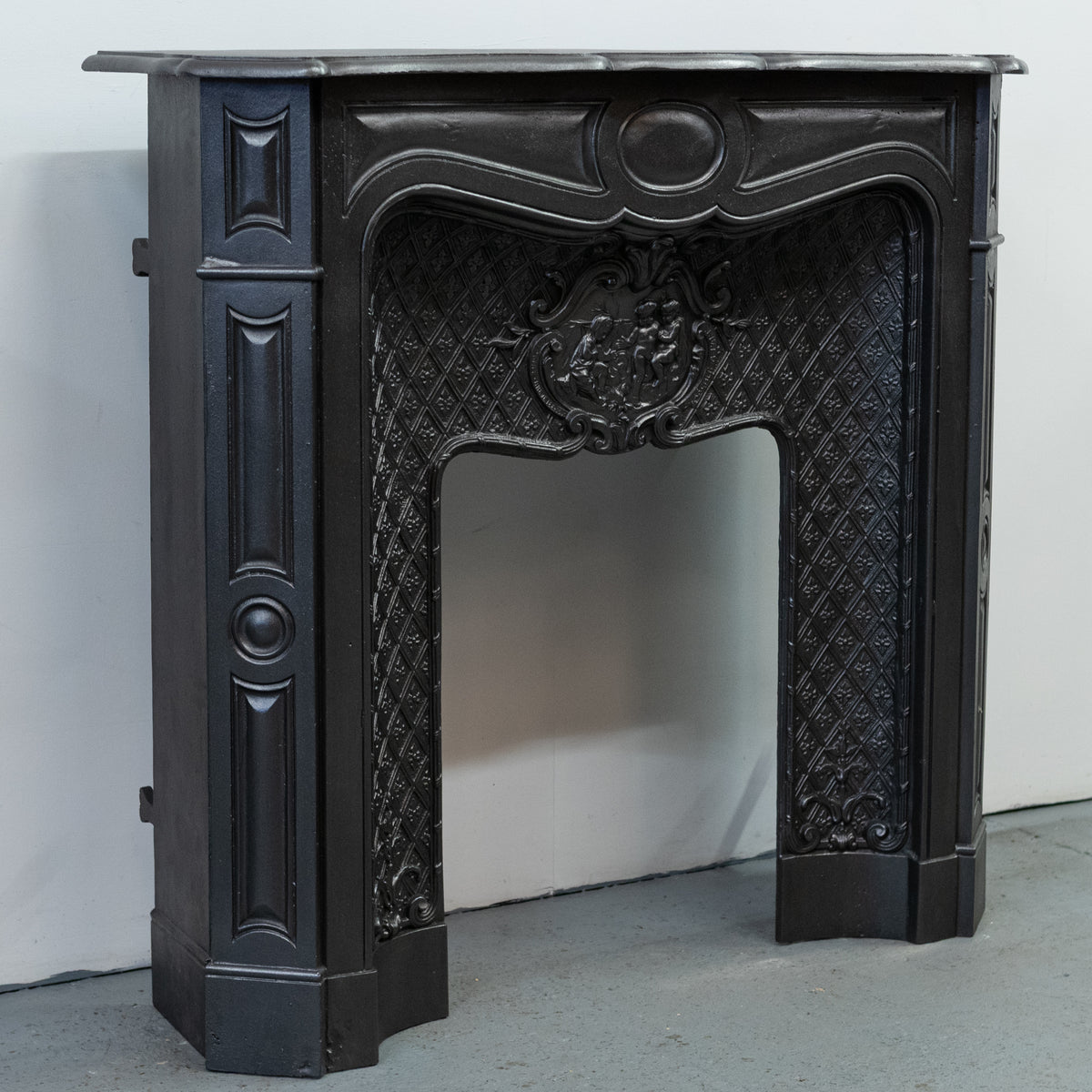 Rare Highly Ornate Antique Cast Iron Fireplace Surround | Pair Available