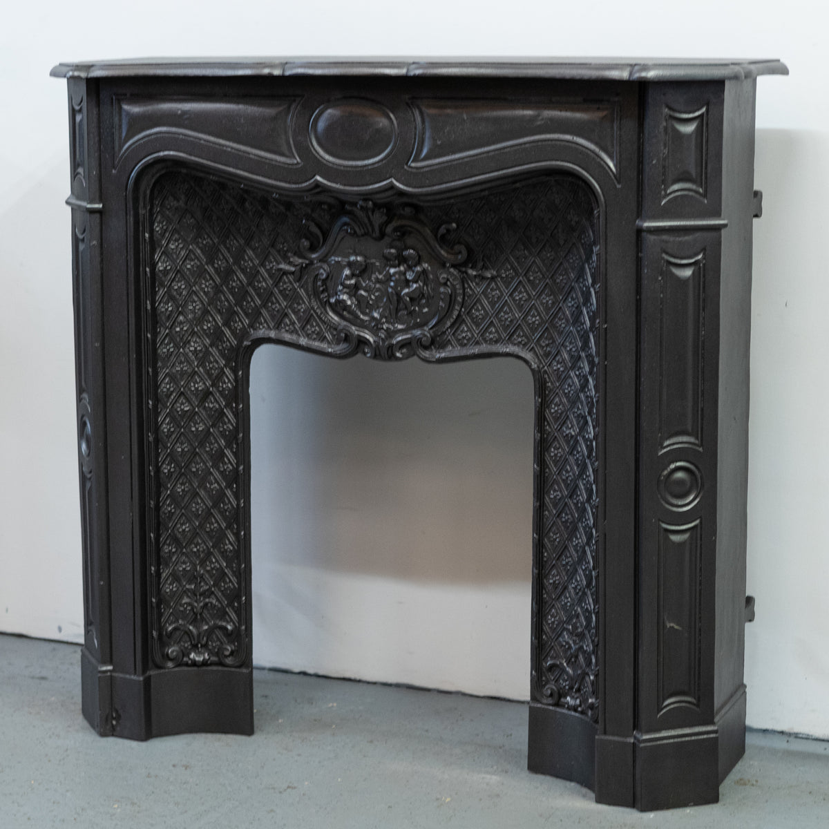 Rare Highly Ornate Antique Cast Iron Fireplace Surround | Pair Available