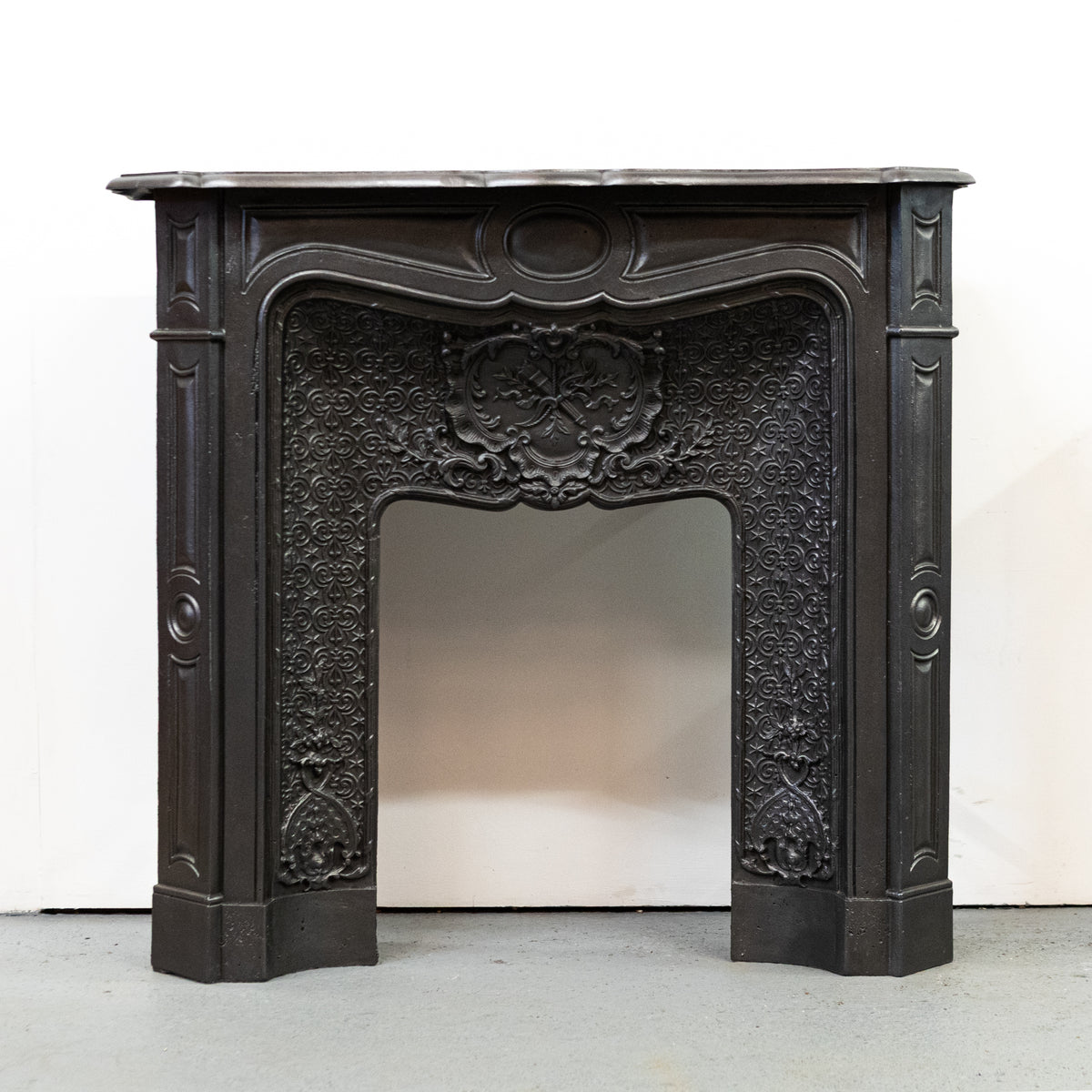Rare Highly Ornate Antique Cast Iron Fireplace Surround | Pair Available