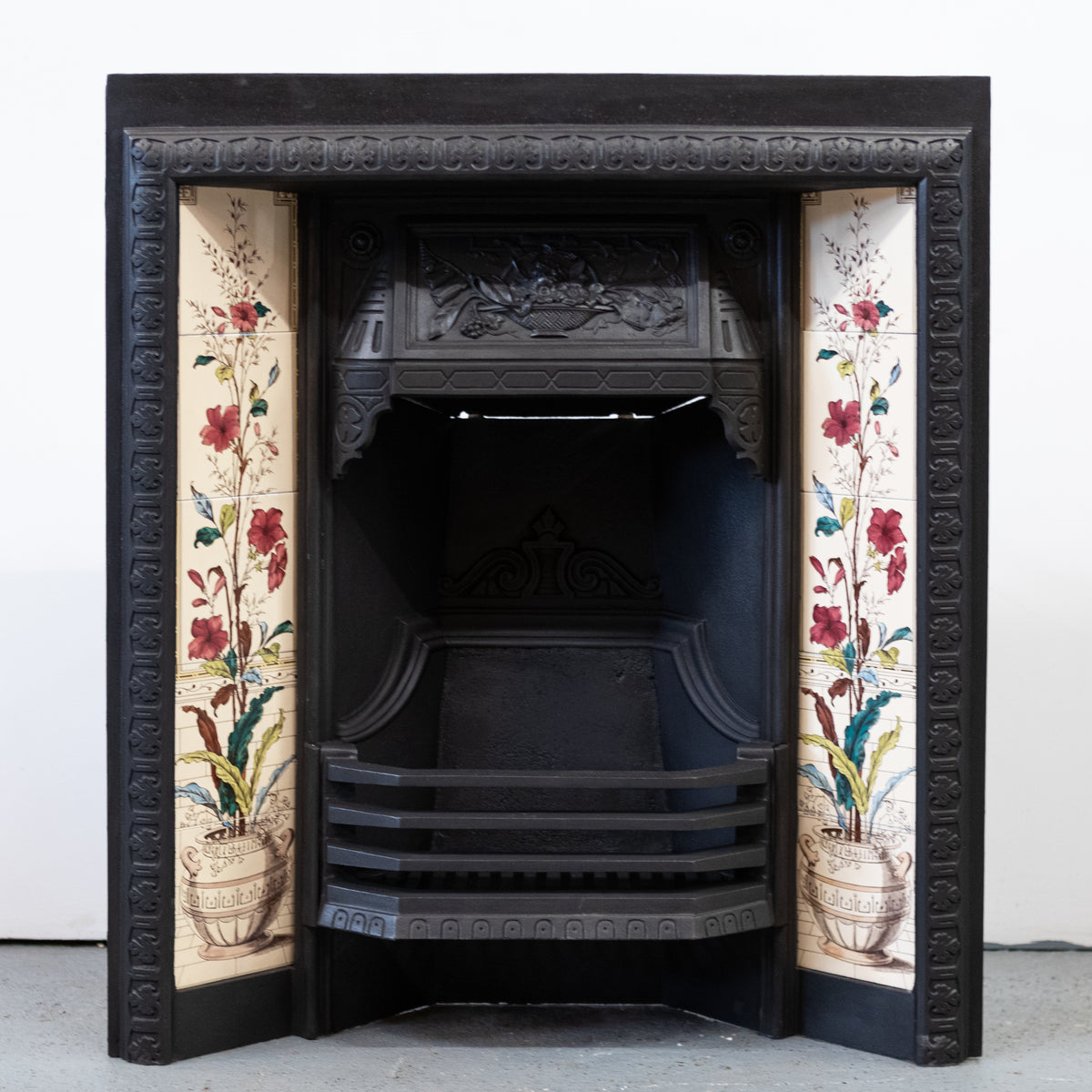 Antique Victorian Cast Iron Fireplace with Decorative Floral Tiles | The Architectural Forum
