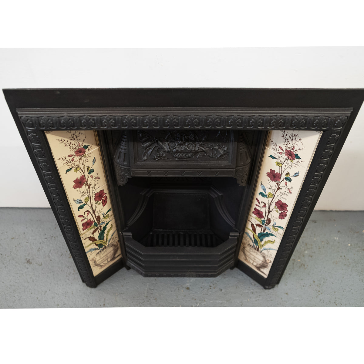 Antique Victorian Cast Iron Fireplace with Decorative Floral Tiles | The Architectural Forum