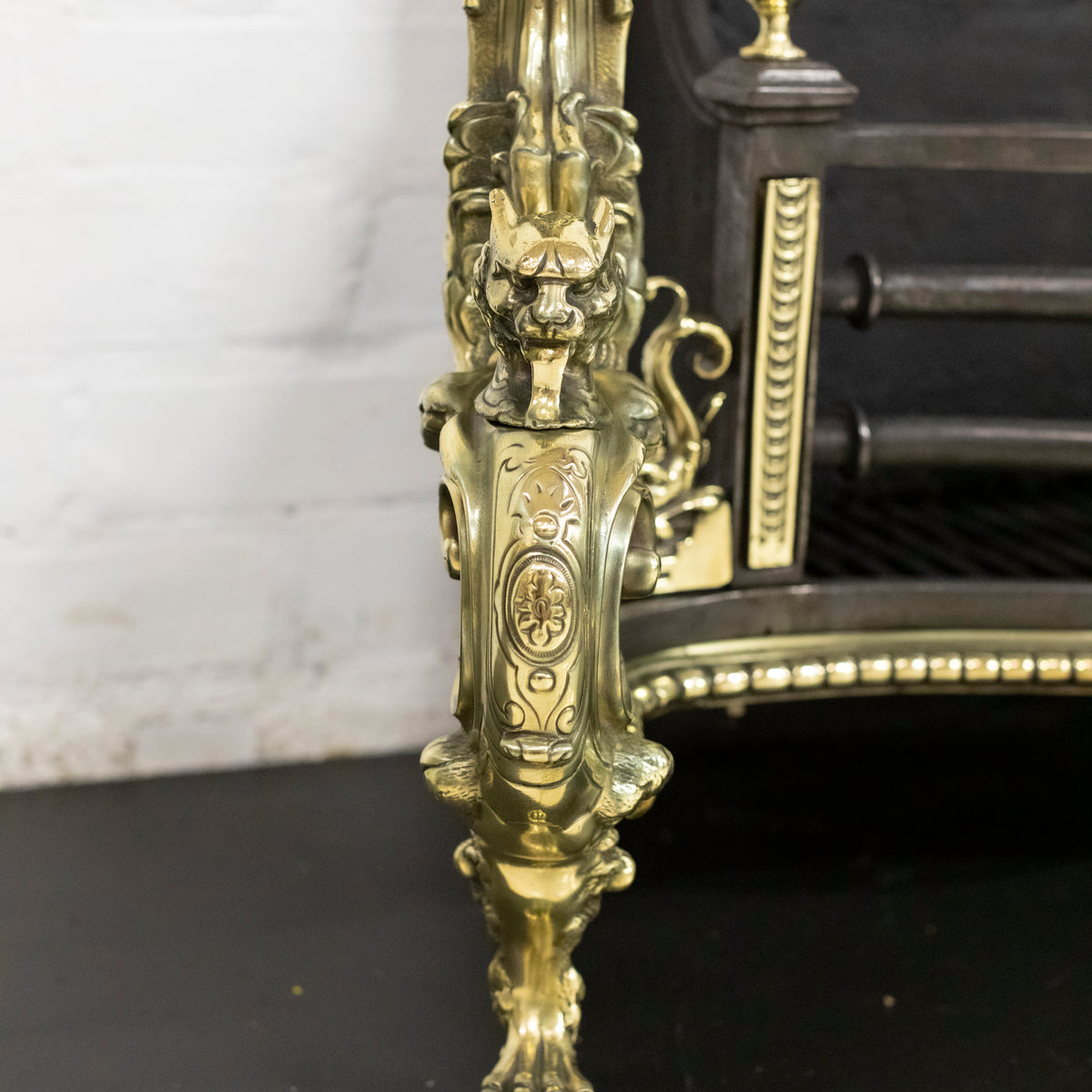 Antique Rococo Style Polished Steel and Brass Fire Basket with Griffins | The Architectural Forum