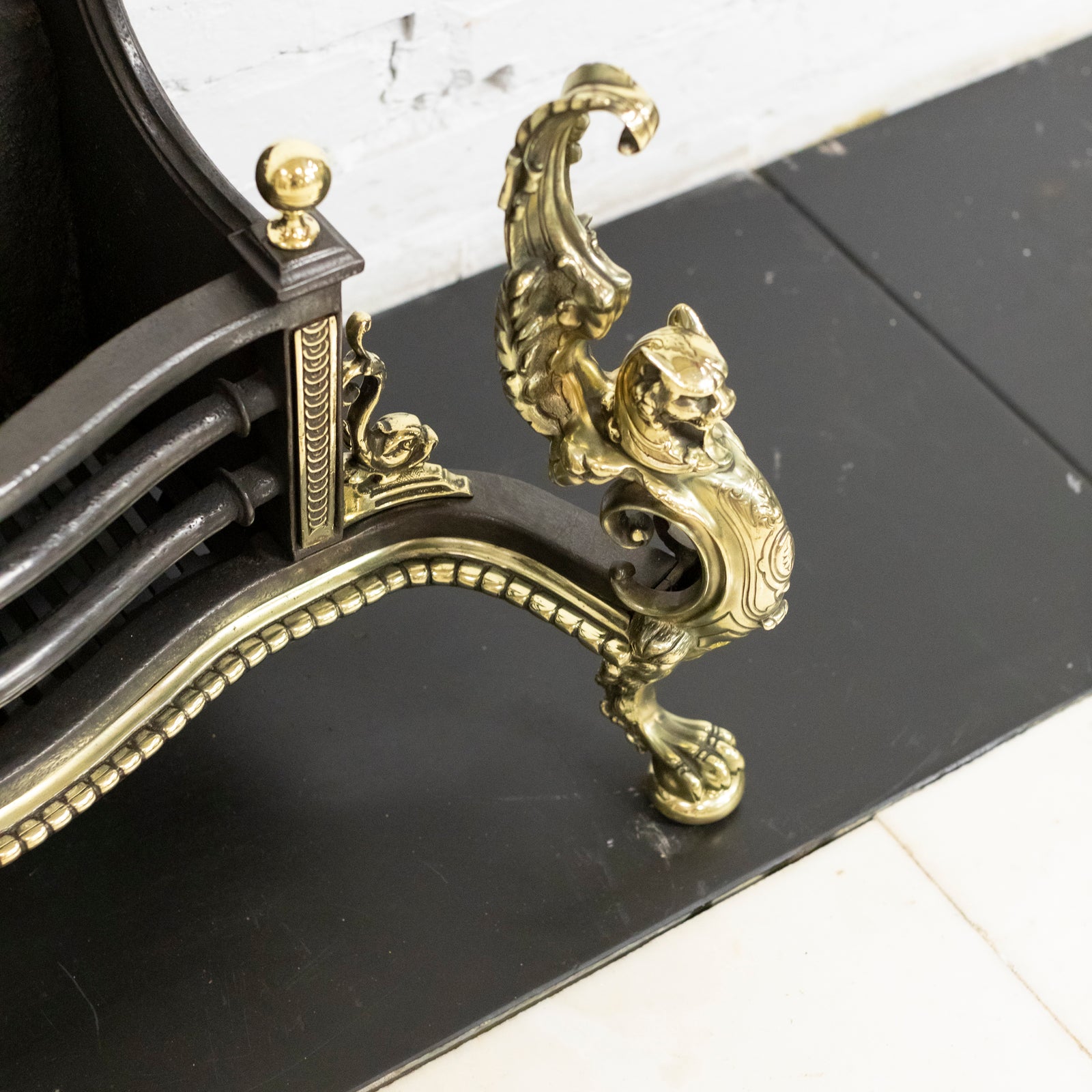 Antique Rococo Style Polished Steel and Brass Fire Basket with Griffins | The Architectural Forum