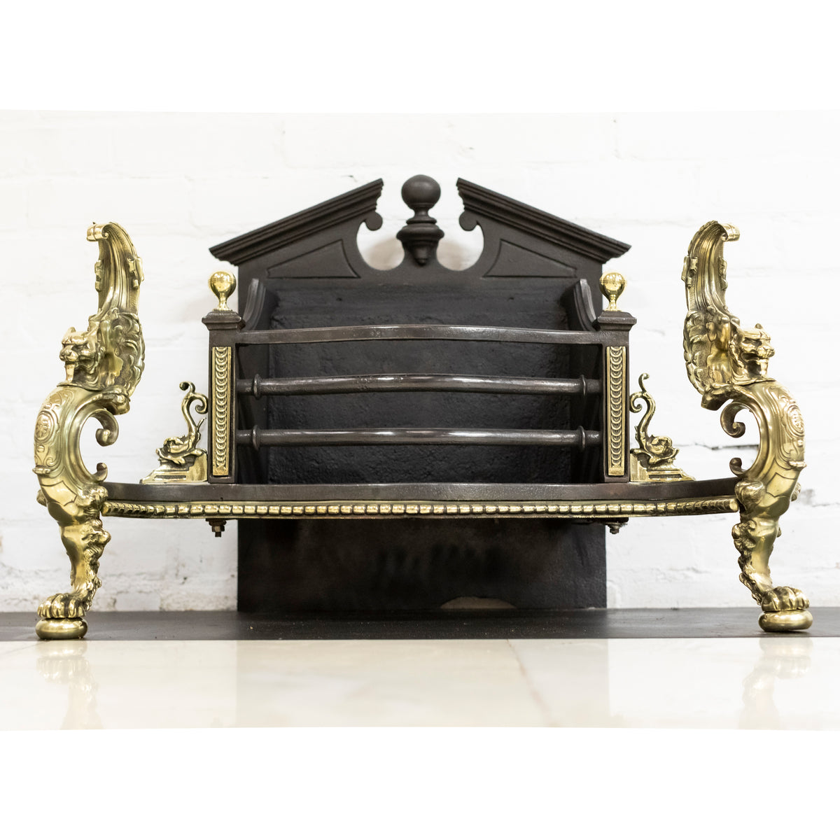 Antique Rococo Style Polished Steel and Brass Fire Basket with Griffins | The Architectural Forum
