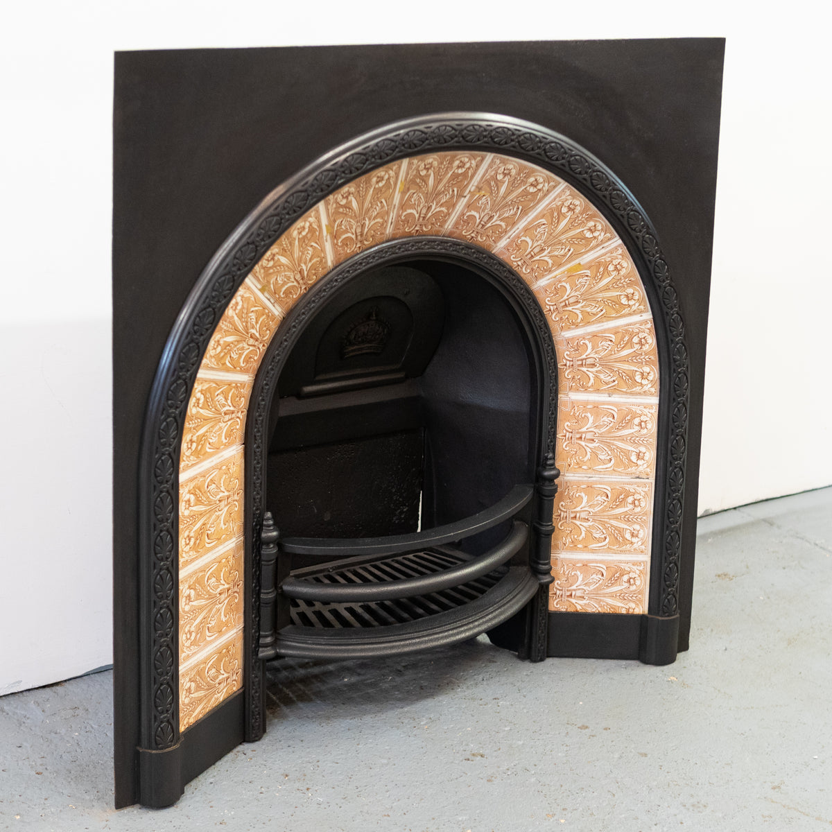 Antique Fireplace Insert with Tiled Arched Opening | Steele & Wood Tiles | The Architectural Forum