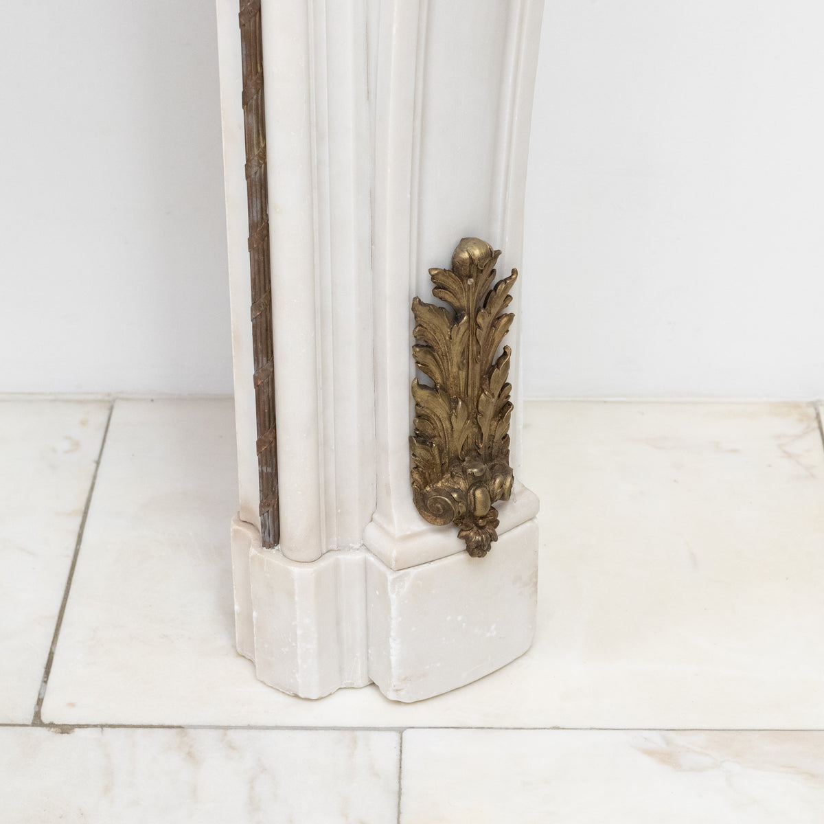 Antique French Louis XV Style Statuary Marble Fireplace with Brass Mounts | The Architectural Forum