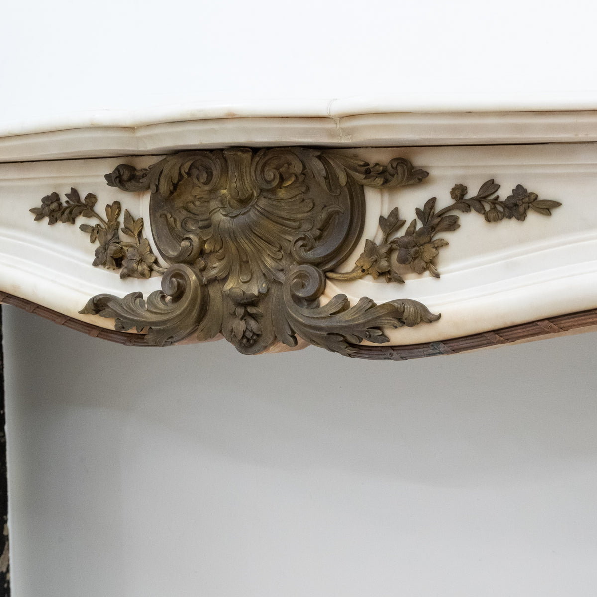 Antique French Louis XV Style Statuary Marble Fireplace with Brass Mounts | The Architectural Forum