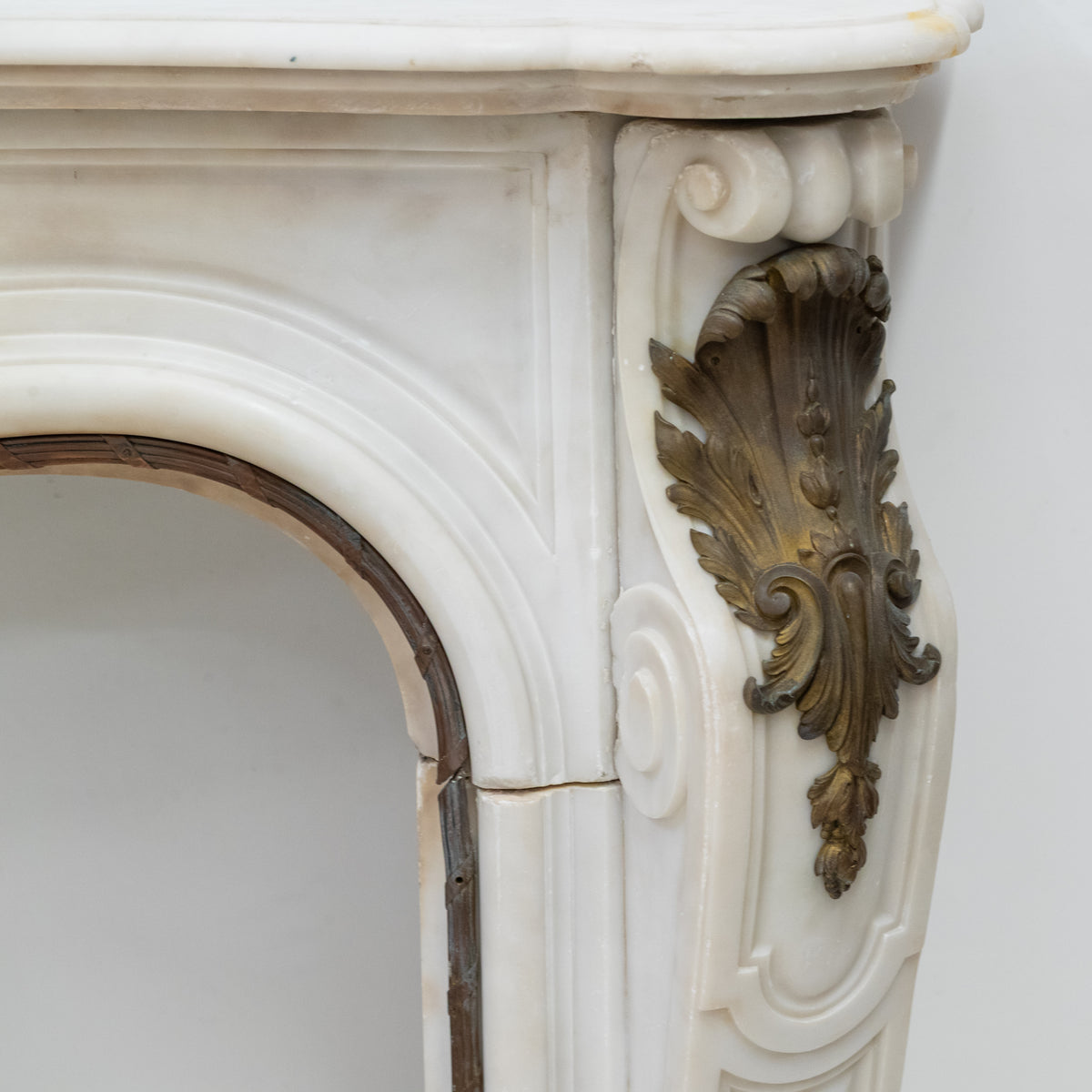Antique French Louis XV Style Statuary Marble Fireplace with Brass Mounts | The Architectural Forum