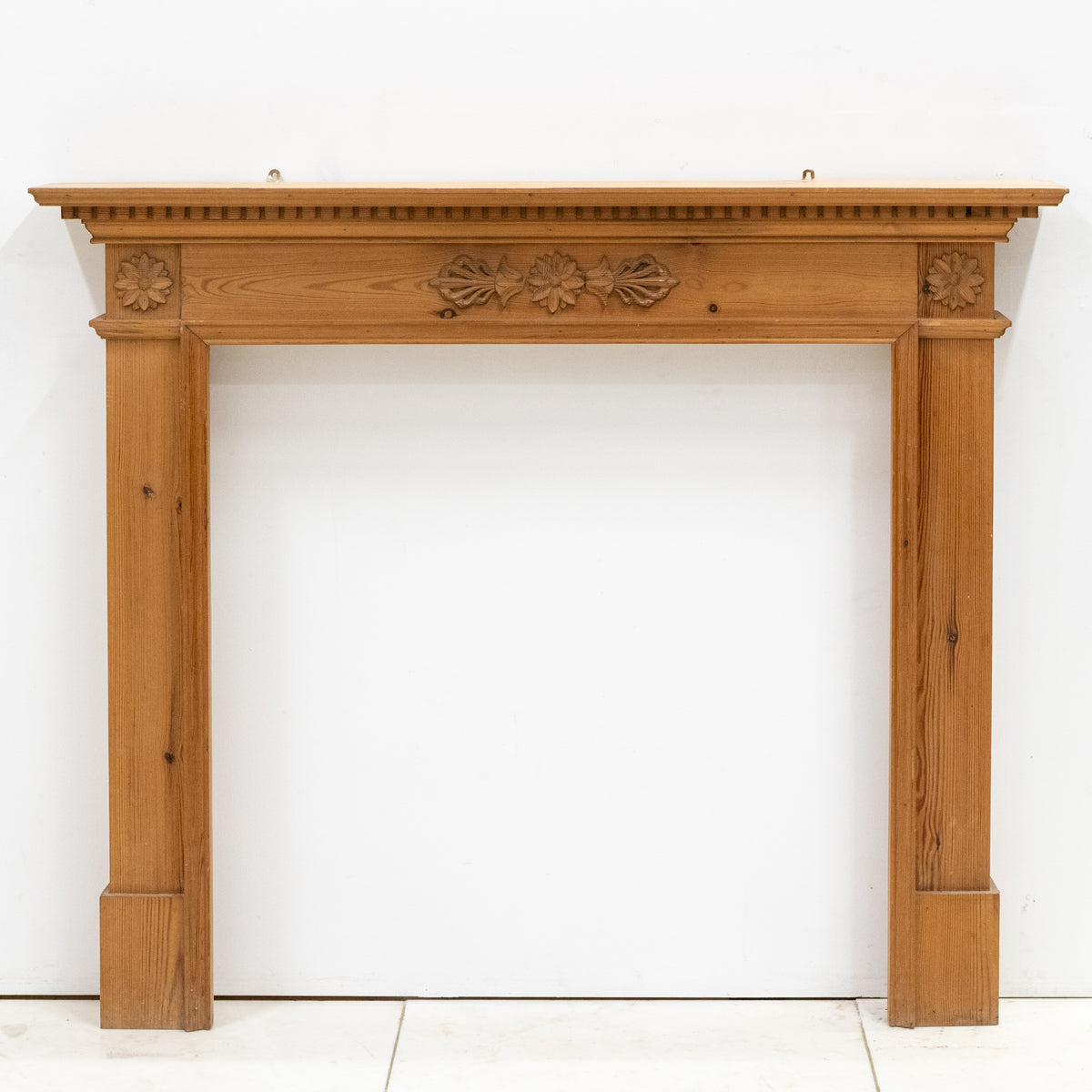 Antique Wooden Fireplace Surround with Flowers