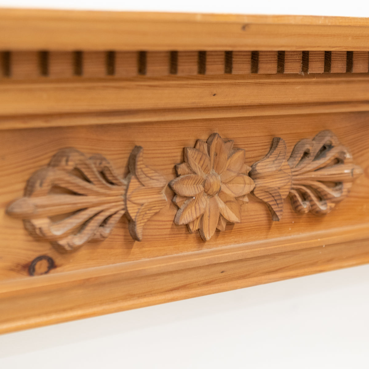 Antique Wooden Fireplace Surround with Flowers