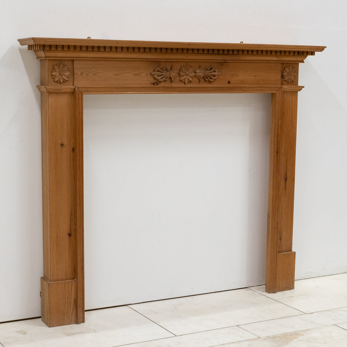 Antique Wooden Fireplace Surround with Flowers