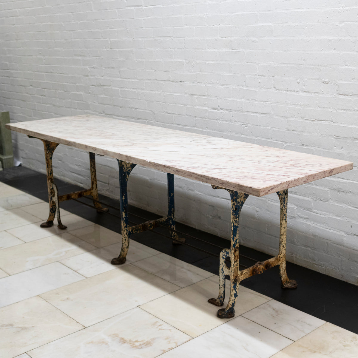 Long Breche Rose Marble Top Table on Cast Iron Legs | The Architectural Forum