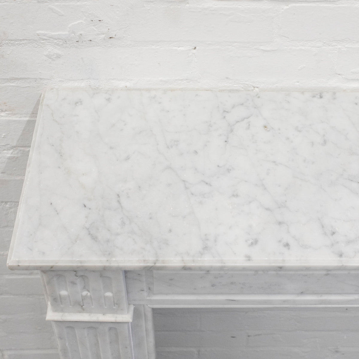 Reclaimed Louis XVI Style Carved Marble Fireplace in Carrara Marble | The Architectural Forum