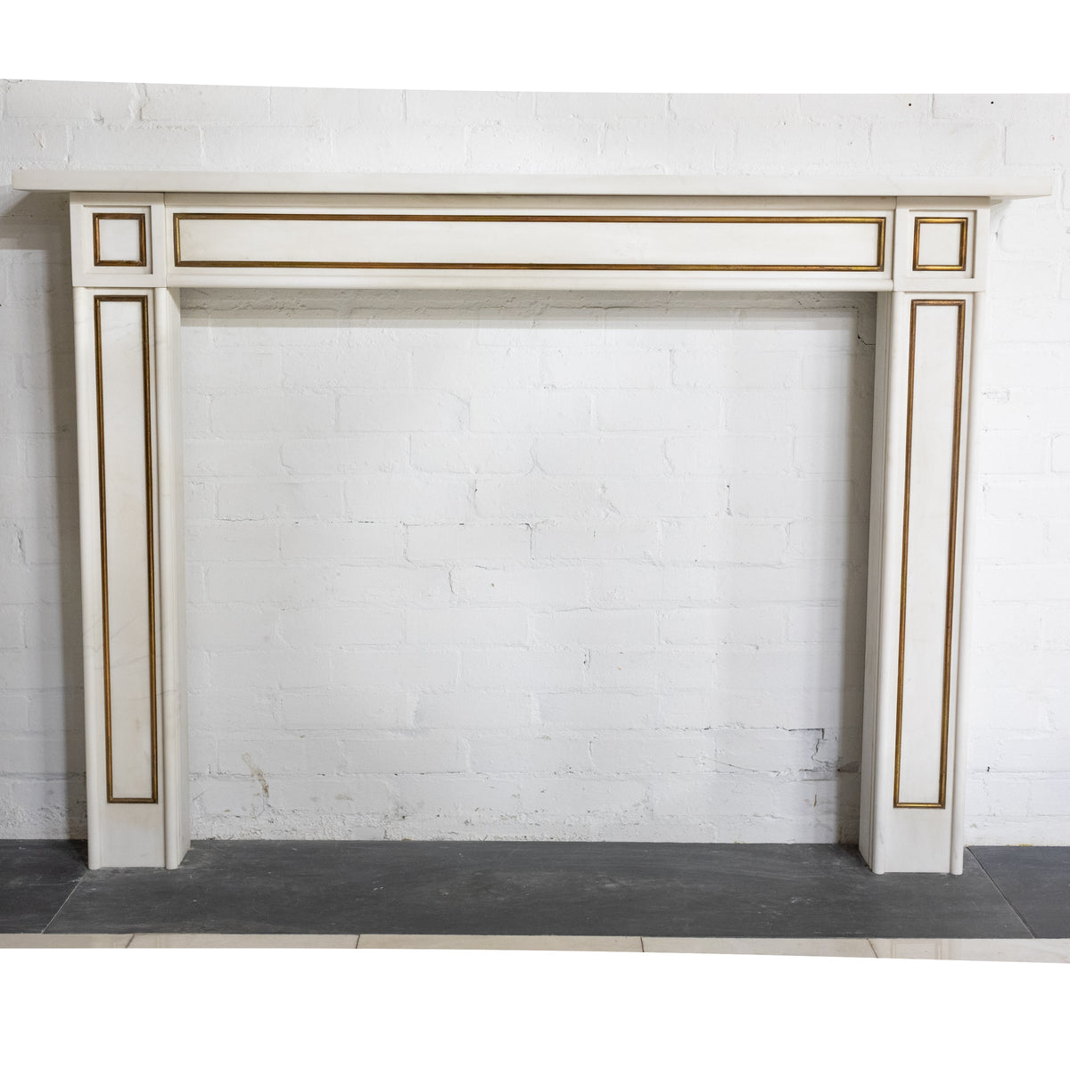 Reclaimed Statuary Marble Fireplace Surround with Brass Detail | The Architectural Forum