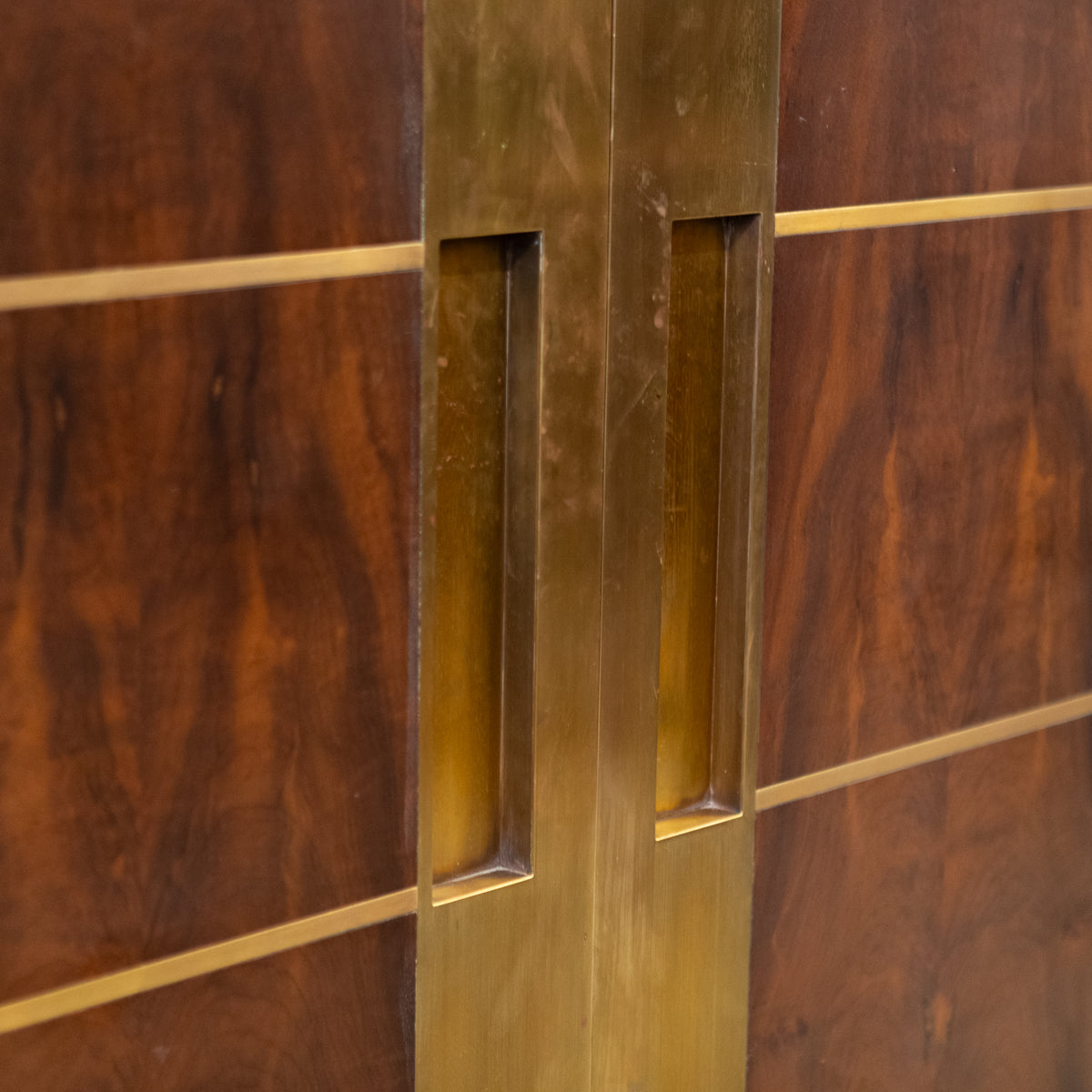 Large Bookmatched Walnut Mirrored Pocket Doors | The Architectural Forum