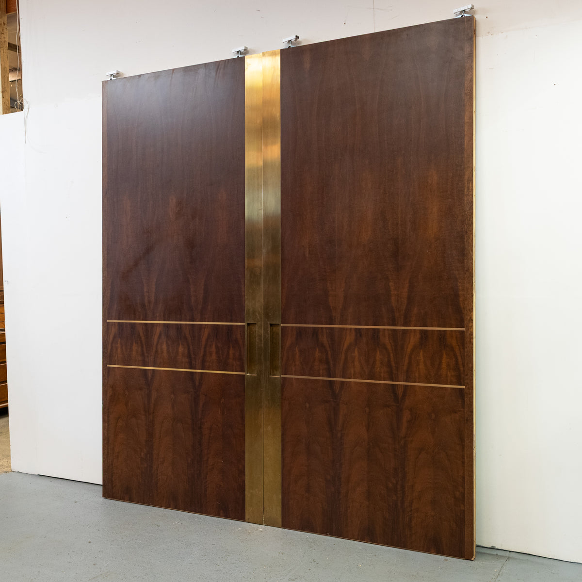 Large Bookmatched Walnut Mirrored Pocket Doors | The Architectural Forum