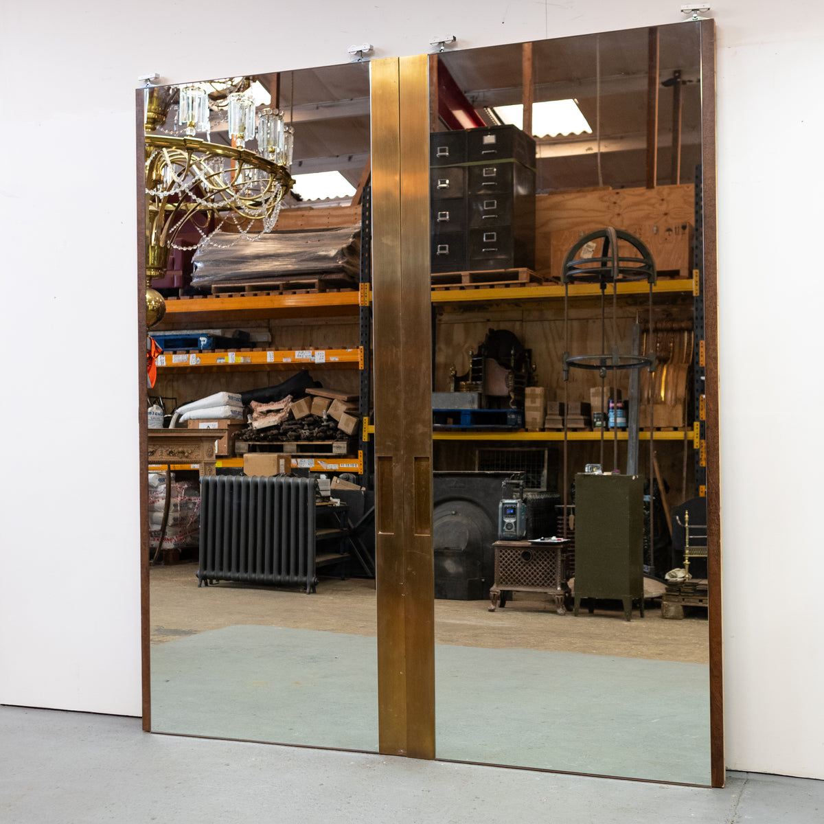 Large Bookmatched Walnut Mirrored Pocket Doors | The Architectural Forum