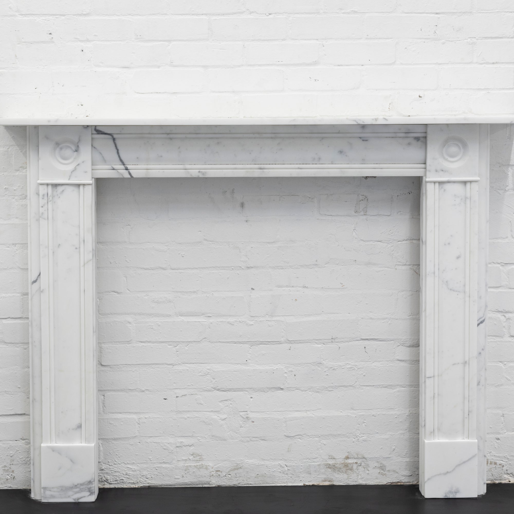 Georgian Style Fireplace Surround with Bullseyes | Reclaimed Carrara Marble | The Architectural Forum