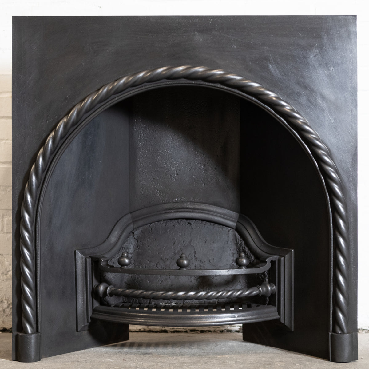 Antique Cast Iron Arched Fireplace Insert with Rope Detail | The Architectural Forum