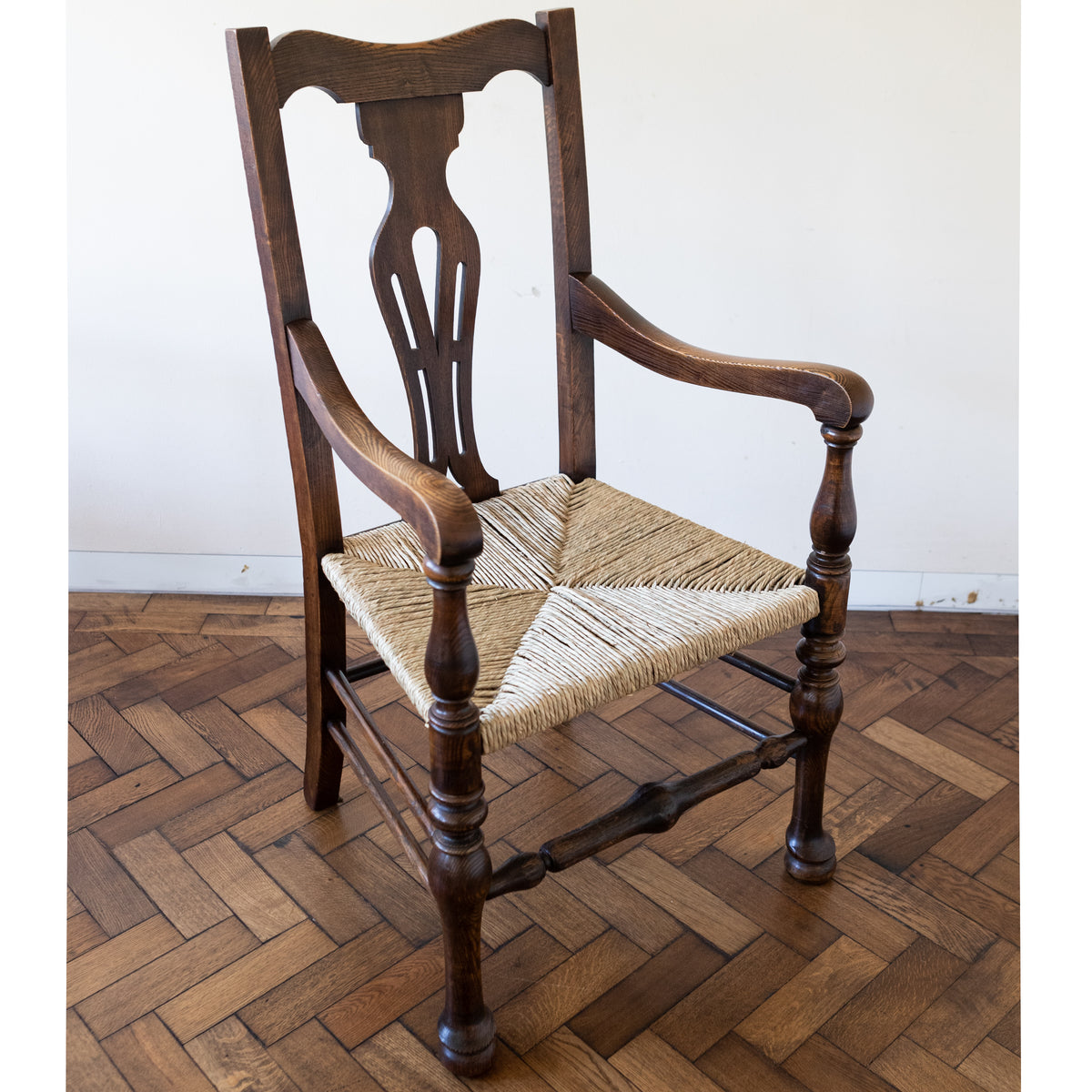 Set of 10 Antique Carver Arm Chairs with Rush Seats | The Architectural Forum