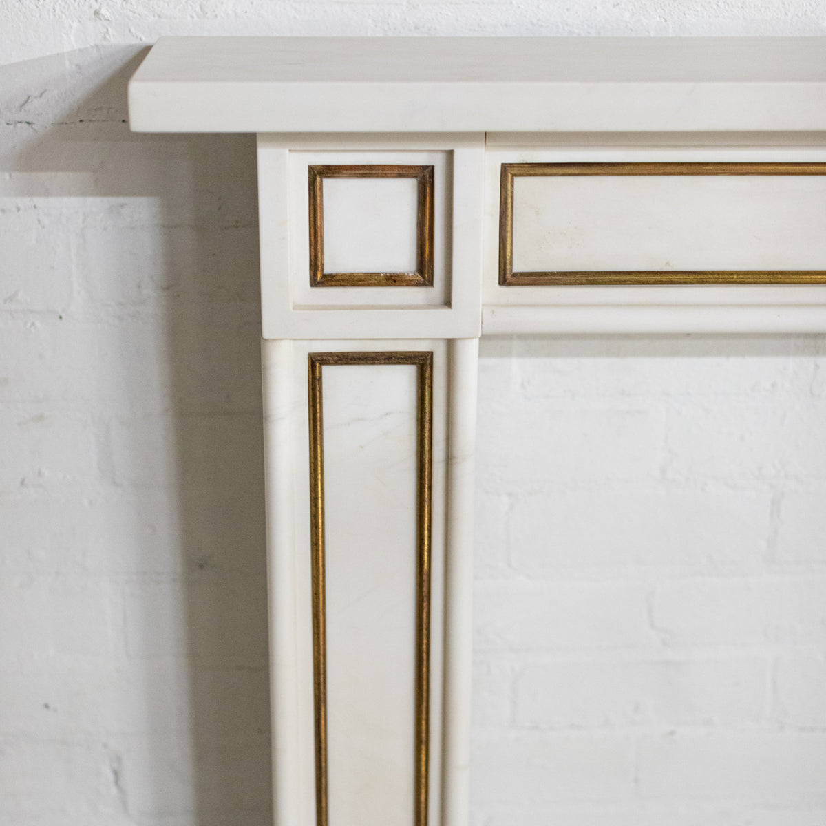 Reclaimed Statuary Marble Fireplace Surround with Brass Detail | The Architectural Forum