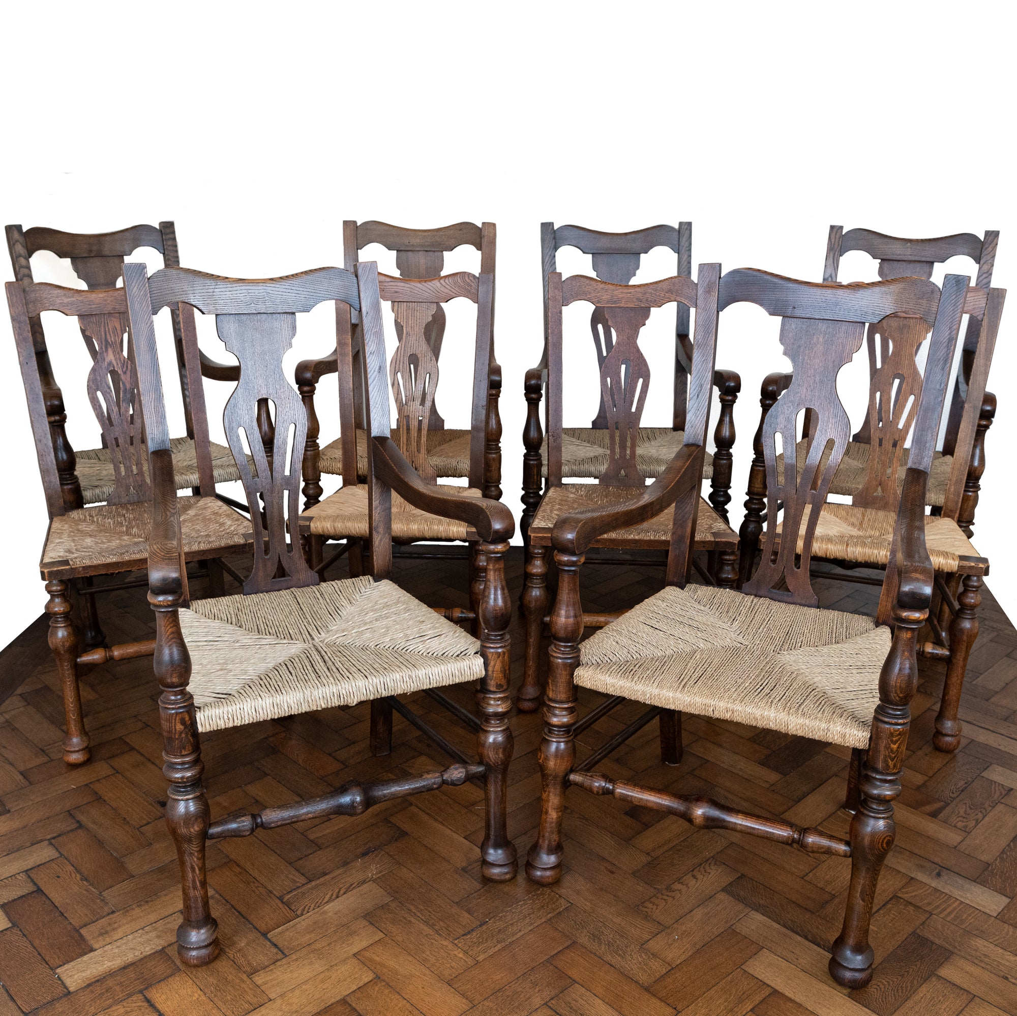 Set of 10 Antique Carver Arm Chairs with Rush Seats | The Architectural Forum